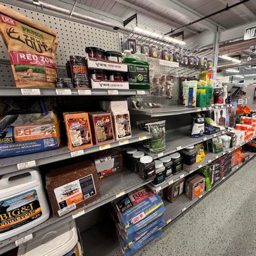 A display of wildlife feed, supplements, & attractants within Village Hardware & Rental. 