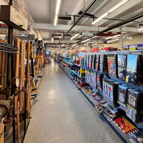 A display of decorative flags within Village Hardware & Rental. 