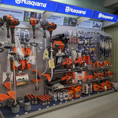 A display of Husqvarna outdoor equipment within Village Hardware & Rental. 